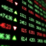 Stock market ticker board blurred at edges